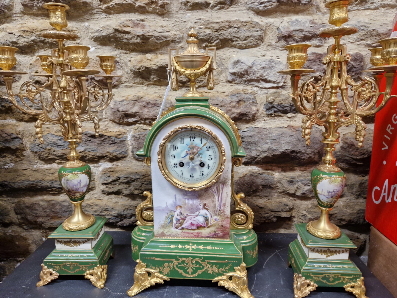 A LATE 19th/EARLY 20th C. FRENCH APPLE GREEN AND GILT PORCELAIN CLOCK GARNITURE, THE CLOCK WITH