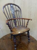 A 19th C. YEW WOOD CHILDS WINDSOR CHAIR WITH A CRINOLINE STRETCHER