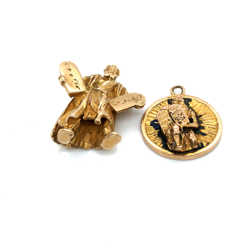 TWO VINTAGE PENDANTS DEPICTING MOSES HOLDING TWO TABLETS OF THE TEN COMMANMENTS. THE LARGE PENDANT