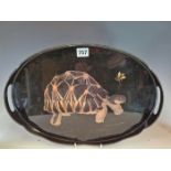 A BLACK LACQUER OVAL TWO HANDLED TRAY DECORATED WITH A FLY ABOVE A TORTOISE. W 41cms.