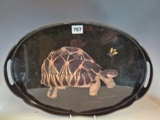 A BLACK LACQUER OVAL TWO HANDLED TRAY DECORATED WITH A FLY ABOVE A TORTOISE. W 41cms.