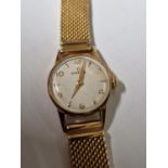 AN OMEGA LADIES WRIST WATCH ON MESH STRAP STAMPED 750 AND  ASSESSED AS 18ct GOLD. WEIGHT 29.15 g