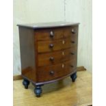 A 19th C. MAHOGANY MINIATURE BOW FRONT CHEST OF TWO SHORT AND THREE GRADED LONG DRAWERS, EACH WITH