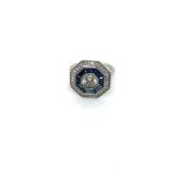 A PLATINUM HALLMARKED SAPPHIRE AND DIAMOND TARGET RING. THE CENTRAL DIAMOND APPROX DIAMETER 6.2mm.