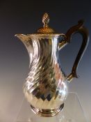 A SPIRALLY FLUTED BALUSTER COFFEE POT BY JOHN NEWTON MAPPIN, LONDON 1882, WITH A TREEN HANDLE, 438.