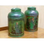 TWO GREEN GROUND TOLE TEA CANNISTERS AND COVERS, THE CYLINDRICAL BODIES DECORATED WITH CHINESE
