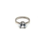 A CUBIC ZIRCONIA SOLITAIRE RING. UNHALLMARKED, STAMPED 18ct, ASSESSED AS 18ct WHITE GOLD. FINGER
