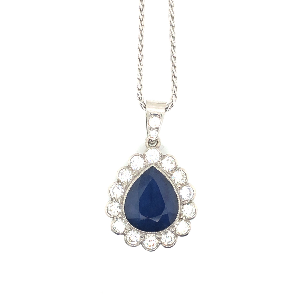 A SAPPHIRE AND DIAMOND TEARDROP CLUSTER PENDANT, SUSPENDED ON A PLATINUM HALLMARKED SPIGA LINK