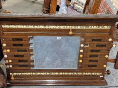 A MAHOGANY SNOOKER SCORE BOARD WITH CENTRAL SLATE TO TAKE CHALK DETAILS. 69 x 102.5cms.