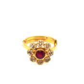 AN EASTERN GEMSET AND DIAMOND FLORAL CLUSTER RING. UNHALLMARKED, ASSESSED AS 22ct GOLD. FINGER