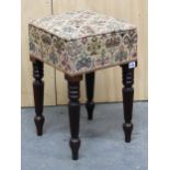 A VICTORIAN MAHOGANY STOOL, THE UPHOLSTERED SEAT ON REEDED LEGS TAPERING TO SPINDLE FEET, IN THE