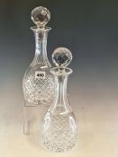 A PAIR OF ATLANTIS CUT GLASS DECANTERS AND STOPPERS OF GLOBE AND SHAFT SHAPE