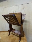 A 19th C. OAK MUSIC AND BOOK STAND, THE SLATTED SIDES OPENING OUT FROM THE CENTRAL BRASS HANDLE TO