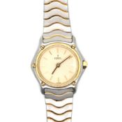 A LADIES EBEL WAVE QUARTZ WRISTWATCH. CHAMPAGNE DIAL WITH GOLD BATONS. LENGTH APPROX 15cms.