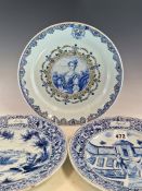 A PAIR OF DUTCH DELFT BLUE AND WHITE PLATES PAINTED WITH SCENES FOR THE MONTHS OF APRIL AND JULY,