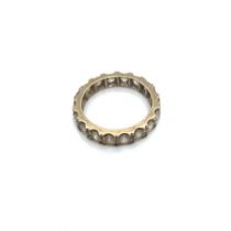A VINTAGE STONE SET FULL ETERNITY RING. FINGER SIZE N CENTRE. WEIGHT 3.54grms.