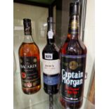 RUM AND PORT: LITRE BOTTLES OF BACARDI SUPERIOR AND CAPTAIN MORGAN RUM TOGETHER WITH A BOTTLE OF