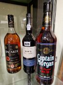 RUM AND PORT: LITRE BOTTLES OF BACARDI SUPERIOR AND CAPTAIN MORGAN RUM TOGETHER WITH A BOTTLE OF