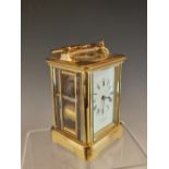 A DROCOURT, PARIS, CARRIAGE CLOCK STRIKING ON A COILED ROD AND RETAILED BY J W BENSON. H 12cms.