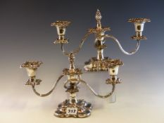 A PAIR OF PLATE ON COPPER THREE LIGHT CANDELABRA WORKED WITH BANDS OF LEAVES ABOVE THE SHAPED SQUARE
