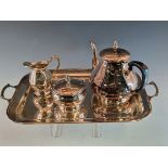 A SILVER THREE PIECE TEA SERVICE ON A TWO HANDLED TRAY BY FRANK HAWKER, BIRMINGHAM 1969, THE TEA POT