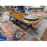 A REGENCY STYLE MAHOGANY AND EBONY STRUNG THREE PILLAR DINING TABLE. H 73 W 228 D 106cms