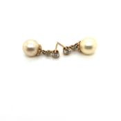 A PAIR OF CULTURED PEARL AND GRADUATED DOUBLE DIAMOND DROP EARRINGS. THE CULTURED PEARL APPROX 8.
