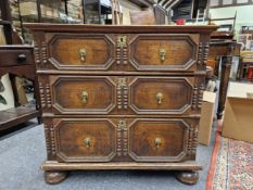 AN 18th C. AND LATER OAK CHEST OF THREE GRADED LONG DRAWERS EACH WITH BRASS DROP HANDLES SET WITHIN