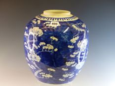 A CHINESE BLUE AND WHITE JAR PAINTED WITH CHERRY BLOSSOMS ON A BLUE GROUND. H 30cms.
