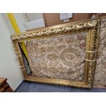 A GILT WOOD AND GESSO PICTURE FRAME CARVED AND MOULDED WITH FOLIAGE. OUTSIDE MEASUREMENTS 230 x