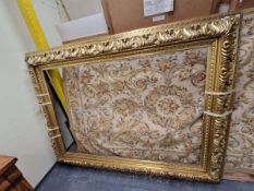 A GILT WOOD AND GESSO PICTURE FRAME CARVED AND MOULDED WITH FOLIAGE. OUTSIDE MEASUREMENTS 230 x