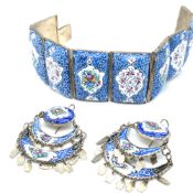 INDO PERSIAN ENAMELLED EIGHT PANELLED BRACELET TOGETHER WITH A PAIR OF MATCHING EARRING DROPS.