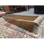 A HOLLOWED OUT TREE TRUNK RECTANGULAR TROUGH, POSSIBLY TEAK. W 141 x D 31.5 x H 25cms.