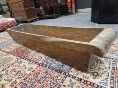 A HOLLOWED OUT TREE TRUNK RECTANGULAR TROUGH, POSSIBLY TEAK. W 141 x D 31.5 x H 25cms.
