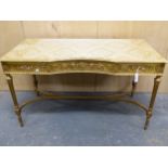 A LATE 19th C. FRENCH GILT WOOD WRITING TABLE,THE THREE DRAWER FRONTS CARVED WITH SCROLLING FOLIAGE,