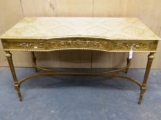 A LATE 19th C. FRENCH GILT WOOD WRITING TABLE,THE THREE DRAWER FRONTS CARVED WITH SCROLLING FOLIAGE,