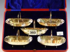 A CASED SET OF FIVE SILVER SWEET BASKETS BY JAMES DIXON AND SONS, SHEFFIELD 1910, EACH OF THE TRUG