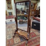 A 19th C. MAHOGANY FULL LENGTH CHEVAL MIRROR, THE COLUMNS SUPPORTING THE RECTANGULAR PLATE ON A