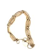A 9ct HALLMARKED GOLD SHAPED FOUR BAR GATE BRACELET. LENGTH APPROX 18cms. WEIGHT 16.93grms.