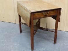 A GEORGE III MAHOGANY PEMBROKE TABLE WITH A DRAWER TO ONE END, THE CHANNELLED LEGS JOINED BY A