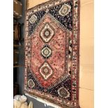 A PERSIAN TRIBAL CARPET. 310 x 217cms