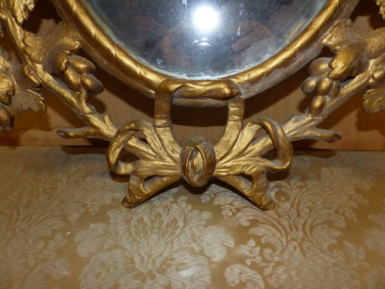 AN OVAL MIRROR IN A LATE 18th C. GILT FRAME PIERCED AND CARVED WITH GRAPE VINES. 95 x 64cms. - Image 6 of 12