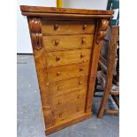 A 19th C. CEDAR WELLINGTON CHEST, THE FIVE DRAWERS AND CUPBOARD BELOW LOCKING BY A HINGED PILASTER