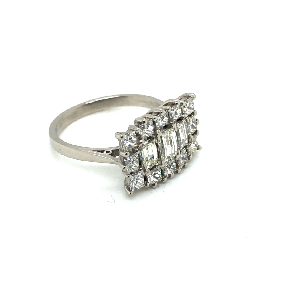 A PRINCESS AND EMERALD CUT HORIZONTAL DIAMOND CLUSTER RING. UNHALLMARKED, ASSESSED AS PLATINUM. - Image 3 of 3