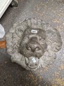 A 19th C. LEAD LION MASK FOUNTAIN HEAD, THE WATER TO COME OUT BETWEEN HIS TEETH. H 41cms.