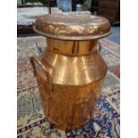 A COPPER TWO HANDLED MILK CHURN. H 52cms.