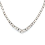 A GRADUATED DIAMOND TENNIS LINE NECKLACE. APPROX ESTIMATED DIAMOND WEIGHT 11.60cts. UNHALLMARKED,