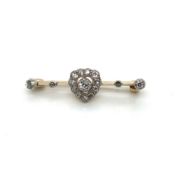 AN ANTIQUE DIAMOND BAR BROOCH. THE CENTRE HEART CLUSTER SYMMETRICALLY SET WITH FOUR OLD CUT