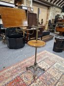 A VICTORIAN BRASS, MAHOGANY AND IRON MUSIC STAND TABLE, THE LECTERN ON AND ADJUSTABLE ARM AND COLUMN