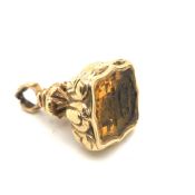 AN EARLY 20th CENTURY CARVED INTAGLIO SEAL FOB WITH MONOGRAM AND CREST OF A RESTING DOG WITH CROWN